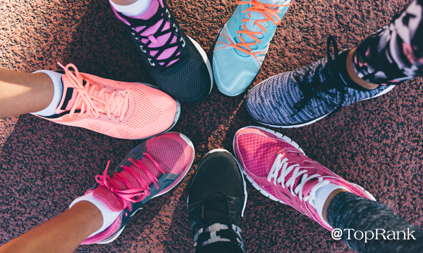 Runners touching colorful shoes together image.