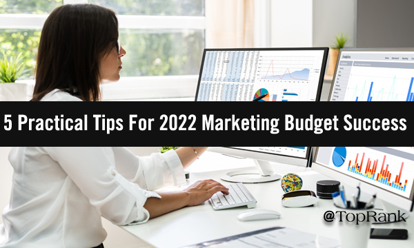 Woman planning marketing budgets at desk image.