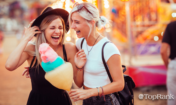 Two women with cotton candy image.